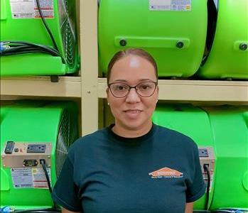 woman portrait smiling green background servpro air movers employee