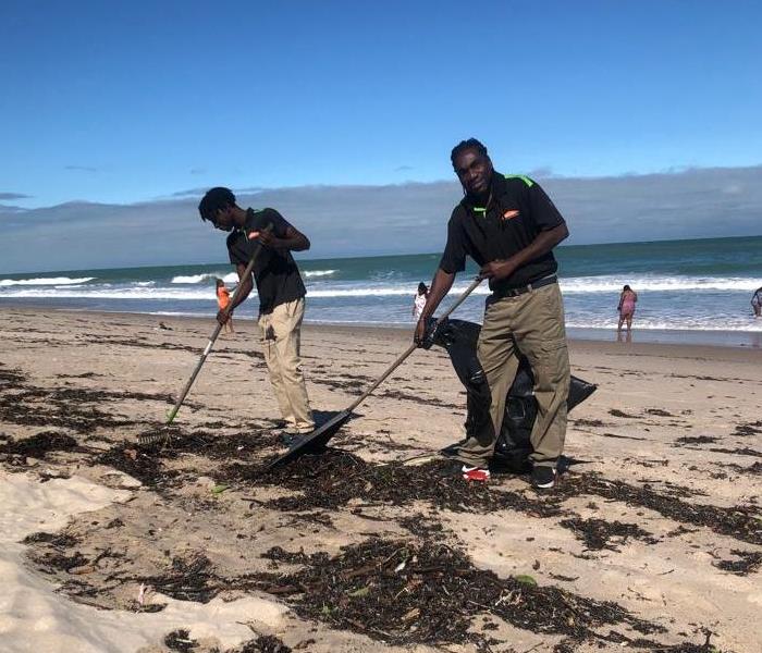 cleaning beach Dania Beach employee owner SERVPRO community service